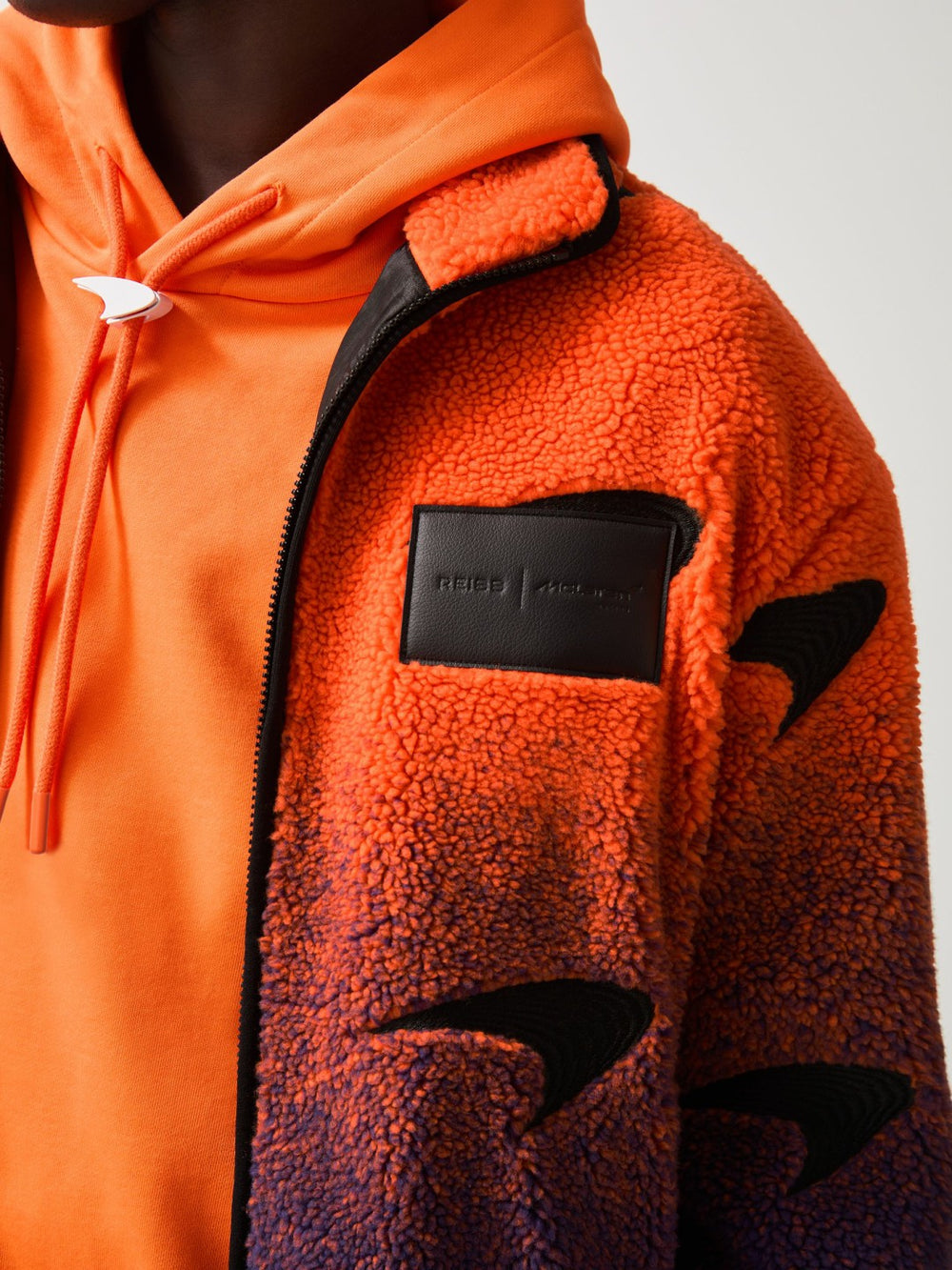 Unisex Fit McLaren F1 Team Ombré Fleece Jacket in Papaya Orange/Purple | Reiss Near Me