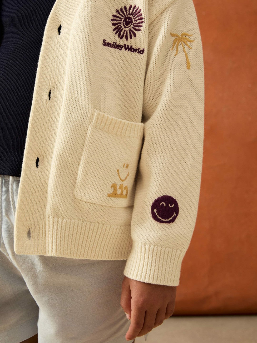 4-9 yrs SmileyWorld Embroidery Cardigan Unisex Fit in Off White | Reiss Near Me